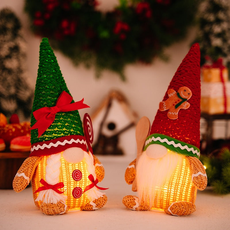 Christmas decoration gingerbread figurine glowing biscuit figurine red green pointed hat with light figurine